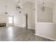 Inviting living room with vaulted ceilings, tiled fireplace and gray vinyl floors at 1080 Abington Ct, Douglasville, GA 30134