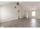 Spacious living room with high ceilings, gray flooring, and natural light at 1080 Abington Ct, Douglasville, GA 30134