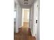Hallway with hardwood floors and multiple doors leading to various rooms, providing easy access throughout the home at 2665 Northview Ave, Decatur, GA 30032