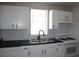 Bright kitchen features white cabinets and stainless steel sink at 2665 Northview Ave, Decatur, GA 30032