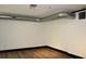 Spacious basement with wood floors and white walls with black trim at 319 Atlanta Se St # 317, Marietta, GA 30060