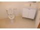 Bathroom with a sink, a toilet, and neutral tile flooring at 319 Atlanta Se St # 317, Marietta, GA 30060