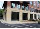 Building entrance with covered parking and sidewalk leads to condo units at 319 Atlanta Se St # 317, Marietta, GA 30060