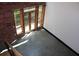 Bright and airy living space with concrete floors and a door to a balcony at 319 Atlanta Se St # 317, Marietta, GA 30060