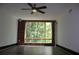 Spacious living room featuring a large window with wooded view and brick accent wall at 319 Atlanta Se St # 317, Marietta, GA 30060