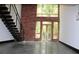 Bright living room with brick wall, wooden windows, and modern staircase at 319 Atlanta Se St # 317, Marietta, GA 30060