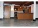 Open concept living space with modern kitchen, concrete floors, and industrial style ceilings at 319 Atlanta Se St # 317, Marietta, GA 30060
