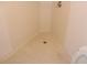 Clean shower area with white tile and a corner drain at 319 Atlanta Se St # 317, Marietta, GA 30060