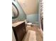 Attic bathroom featuring a dark vanity with granite countertop and shower at 325 Brook Hollow Ln, Loganville, GA 30052