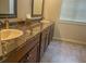 Bathroom featuring a vanity with 2 sinks at 325 Brook Hollow Ln, Loganville, GA 30052