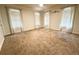 Spacious bedroom with neutral carpeting, modern ceiling fan and lots of natural light at 325 Brook Hollow Ln, Loganville, GA 30052