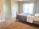 Bedroom features a window, closet, and cozy carpet at 325 Brook Hollow Ln, Loganville, GA 30052