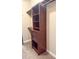 Walk in closet features custom shelving and cabinets for optimal storage at 325 Brook Hollow Ln, Loganville, GA 30052