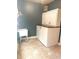 Laundry room with storage cabinets and a wash basin at 325 Brook Hollow Ln, Loganville, GA 30052