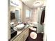 Well-lit bathroom with a modern vanity, sleek fixtures, and a shower-tub combination perfect for relaxation at 579 Wexwood Dr, Riverdale, GA 30274