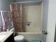 Bathroom featuring shower with shower curtain, sink with vanity, and toilet at 945 Navajo Trl, Covington, GA 30016