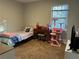 Bedroom with neutral walls, carpet, a single window, desk, and a decorative cat tree at 945 Navajo Trl, Covington, GA 30016