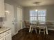 Dining room area featuring hardwood floors and natural light at 945 Navajo Trl, Covington, GA 30016