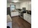 Updated kitchen with stainless steel appliances, and granite countertops at 945 Navajo Trl, Covington, GA 30016