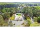 Aerial view of a recreational pool and parking lot surrounded by lush trees at 1430 Oconee Ne Pass, Brookhaven, GA 30319