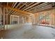 Unfinished basement with open layout, exposed beams, and natural light at 1430 Oconee Ne Pass, Brookhaven, GA 30319