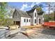 The exterior features an attached garage, white siding and black window trim at 1430 Oconee Ne Pass, Brookhaven, GA 30319