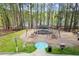 Recreation area with swings and picnic tables, surrounded by trees at 1430 Oconee Ne Pass, Brookhaven, GA 30319
