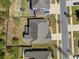 A bird's-eye view of a well-maintained suburban home with a large backyard and mature trees in a quiet neighborhood at 241 Haney Rd, Woodstock, GA 30188
