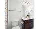 Small bathroom with neutral colored walls, a decorative mirror and a vanity at 241 Haney Rd, Woodstock, GA 30188