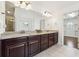 Bathroom features a granite double vanity, large mirror, and tile floors, plus a separate entry to the closet at 241 Haney Rd, Woodstock, GA 30188