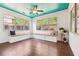 Bright breakfast nook features a cushioned window seat and views of the backyard at 241 Haney Rd, Woodstock, GA 30188