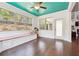 Cozy breakfast nook with teal ceiling, cushioned seating, and natural light at 241 Haney Rd, Woodstock, GA 30188