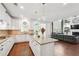 Open layout showcases kitchen with island flowing into the living room with fireplace at 241 Haney Rd, Woodstock, GA 30188