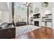 Stunning living room with high ceilings, fireplace, built-ins, and large windows at 241 Haney Rd, Woodstock, GA 30188