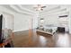 A bright primary bedroom with hardwood floors, a tray ceiling, double doors to bathroom and closets, and ample space at 241 Haney Rd, Woodstock, GA 30188