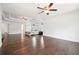 A luxurious primary bedroom with hardwood floors, bright lighting, tray ceiling, and generous space at 241 Haney Rd, Woodstock, GA 30188