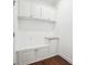 Functional mudroom with built-in bench, storage cabinets, and granite countertop at 241 Haney Rd, Woodstock, GA 30188