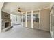 Covered patio featuring a fireplace, ceiling fan, and views of the backyard at 241 Haney Rd, Woodstock, GA 30188