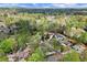 An aerial shot showing lush trees surrounding elegant homes in a neighborhood at 383 Indian Hills Trl, Marietta, GA 30068