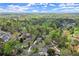 Expansive aerial view showcasing the property's location in a lush, green neighborhood with mature trees at 383 Indian Hills Trl, Marietta, GA 30068