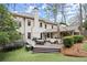 Large backyard with a deck, screened porch, trampoline, and well-maintained lawn perfect for recreation at 383 Indian Hills Trl, Marietta, GA 30068
