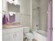 Bathroom with a single sink vanity, neutral countertop, and a shower-tub combo with tiled walls at 383 Indian Hills Trl, Marietta, GA 30068