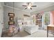 Bedroom with a bunk bed, fun decorations, large windows, and a cozy swing-style chair at 383 Indian Hills Trl, Marietta, GA 30068