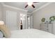 Comfortable bedroom with a neutral palette, crown molding, and serene ambiance at 383 Indian Hills Trl, Marietta, GA 30068