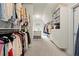 Walk-in closet with custom shelving, drawers, and a window seat offering ample storage space at 383 Indian Hills Trl, Marietta, GA 30068