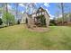 Attractive home with landscaped yard and a combination of brick and dark siding at 383 Indian Hills Trl, Marietta, GA 30068