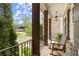 Relaxing front porch with rocking chairs and brick columns, perfect for enjoying the outdoors at 383 Indian Hills Trl, Marietta, GA 30068