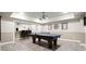 A finished basement featuring a game room area with a ping pong table, perfect for entertainment at 383 Indian Hills Trl, Marietta, GA 30068