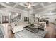 Open-concept living room with coffered ceilings, hardwood floors, and ample seating at 383 Indian Hills Trl, Marietta, GA 30068