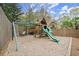 Backyard playground with slide, swings, and playhouse perfect for children at 383 Indian Hills Trl, Marietta, GA 30068